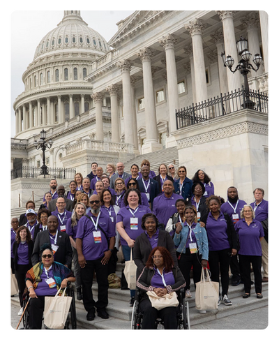 Group of PAN staff, volunteers, and patients gathered in front of the US capitol building