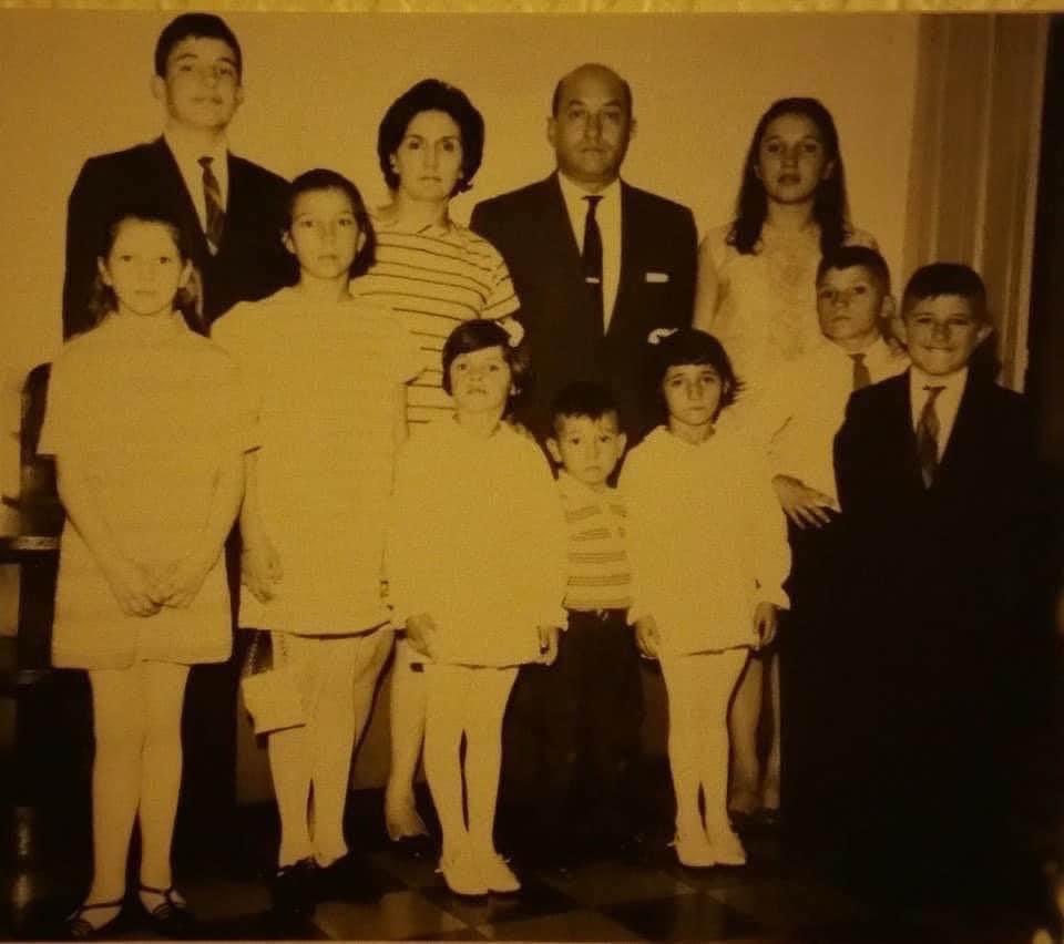 Black and white photo of Beatriz as a child with her family