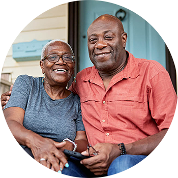 Mature couple sitting together on their porch